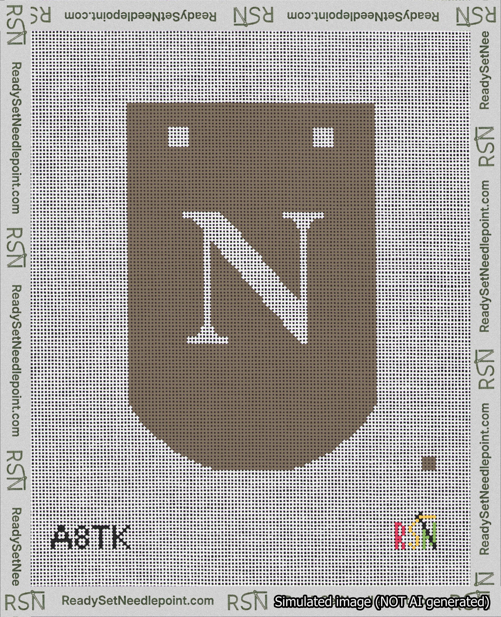 A taped needlepoint canvas with the design: Banner 18 mesh count Curved N White on Brown.