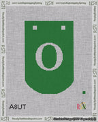 A taped needlepoint canvas with the design: Banner 18 mesh count Curved O White on Green.