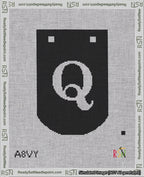 A taped needlepoint canvas with the design: Banner 18 mesh count Curved Q White on Black.