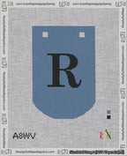 A taped needlepoint canvas with the design: Banner 18 mesh count Curved R Black on Blue.