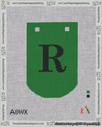 A taped needlepoint canvas with the design: Banner 18 mesh count Curved R Black on Green.