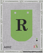 A taped needlepoint canvas with the design: Banner 18 mesh count Curved R Black on Light Green.