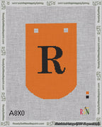 A taped needlepoint canvas with the design: Banner 18 mesh count Curved R Black on Orange.