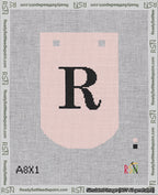 A taped needlepoint canvas with the design: Banner 18 mesh count Curved R Black on Pink.