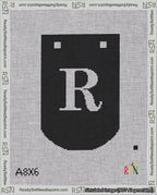 A taped needlepoint canvas with the design: Banner 18 mesh count Curved R White on Black.