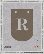 A taped needlepoint canvas with the design: Banner 18 mesh count Curved R White on Brown.