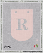 A taped needlepoint canvas with the design: Banner 18 mesh count Curved R White on Pink.