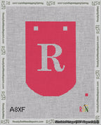 A taped needlepoint canvas with the design: Banner 18 mesh count Curved R White on Red.