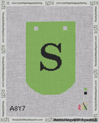 A taped needlepoint canvas with the design: Banner 18 mesh count Curved S Black on Light Green.