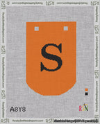 A taped needlepoint canvas with the design: Banner 18 mesh count Curved S Black on Orange.