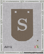 A taped needlepoint canvas with the design: Banner 18 mesh count Curved S White on Brown.