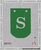 A taped needlepoint canvas with the design: Banner 18 mesh count Curved S White on Green.