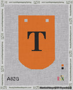 A taped needlepoint canvas with the design: Banner 18 mesh count Curved T Black on Orange.