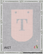 A taped needlepoint canvas with the design: Banner 18 mesh count Curved T White on Pink.