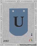 A taped needlepoint canvas with the design: Banner 18 mesh count Curved U Black on Blue.