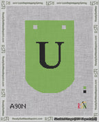 A taped needlepoint canvas with the design: Banner 18 mesh count Curved U Black on Light Green.