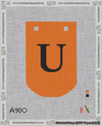 A taped needlepoint canvas with the design: Banner 18 mesh count Curved U Black on Orange.