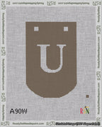 A taped needlepoint canvas with the design: Banner 18 mesh count Curved U White on Brown.