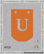 A taped needlepoint canvas with the design: Banner 18 mesh count Curved U White on Orange.
