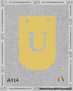 A taped needlepoint canvas with the design: Banner 18 mesh count Curved U White on Yellow.
