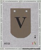A taped needlepoint canvas with the design: Banner 18 mesh count Curved V Black on Brown.