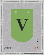 A taped needlepoint canvas with the design: Banner 18 mesh count Curved V Black on Light Green.