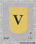 A taped needlepoint canvas with the design: Banner 18 mesh count Curved V Black on Yellow.