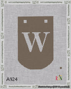 A taped needlepoint canvas with the design: Banner 18 mesh count Curved W White on Brown.