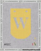 A taped needlepoint canvas with the design: Banner 18 mesh count Curved W White on Yellow.