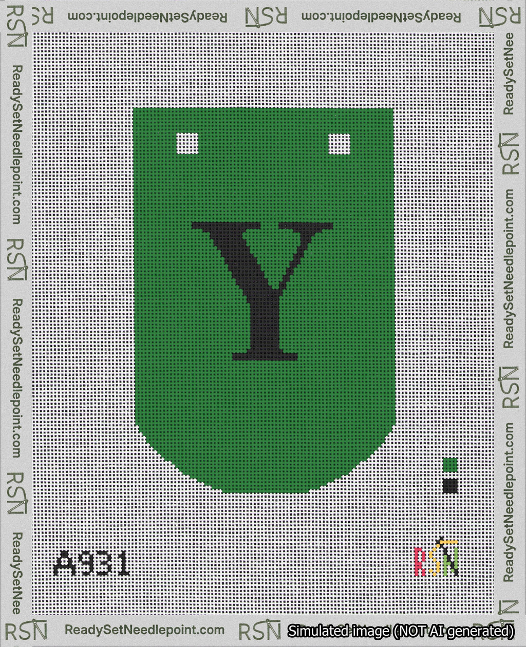 A taped needlepoint canvas with the design: Banner 18 mesh count Curved Y Black on Green.