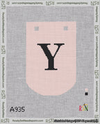 A taped needlepoint canvas with the design: Banner 18 mesh count Curved Y Black on Pink.