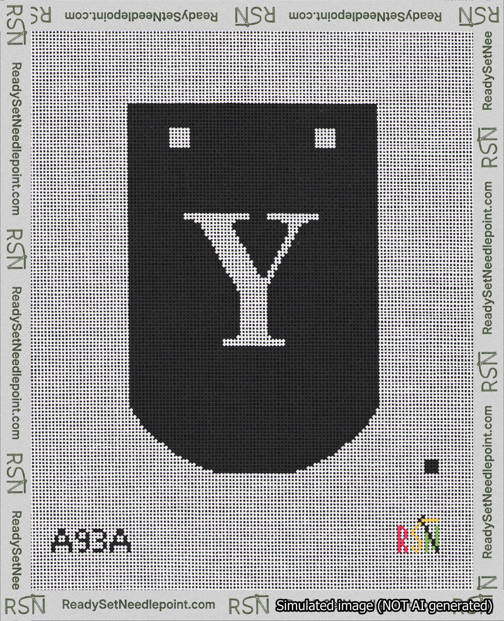 A taped needlepoint canvas with the design: Banner 18 mesh count Curved Y White on Black.