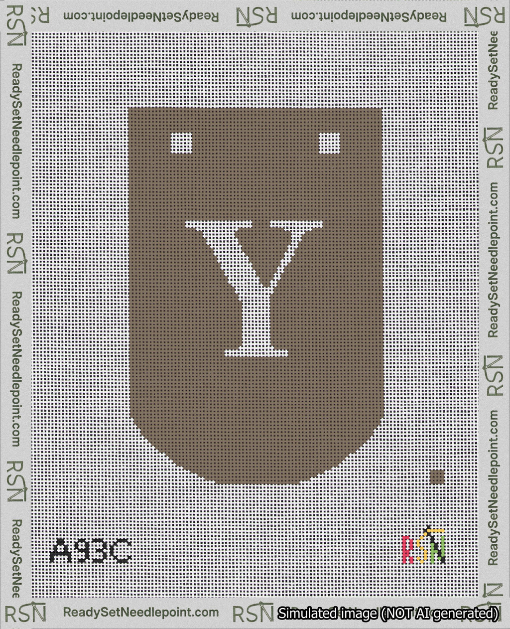 A taped needlepoint canvas with the design: Banner 18 mesh count Curved Y White on Brown.
