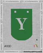 A taped needlepoint canvas with the design: Banner 18 mesh count Curved Y White on Green.