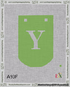 A taped needlepoint canvas with the design: Banner 18 mesh count Curved Y White on Light Green.