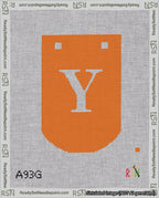 A taped needlepoint canvas with the design: Banner 18 mesh count Curved Y White on Orange.