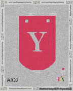 A taped needlepoint canvas with the design: Banner 18 mesh count Curved Y White on Red.