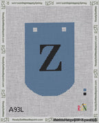 A taped needlepoint canvas with the design: Banner 18 mesh count Curved Z Black on Blue.