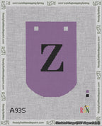A taped needlepoint canvas with the design: Banner 18 mesh count Curved Z Black on Purple.