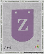 A taped needlepoint canvas with the design: Banner 18 mesh count Curved Z White on Purple.