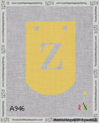 A taped needlepoint canvas with the design: Banner 18 mesh count Curved Z White on Yellow.