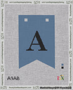 A taped needlepoint canvas with the design: Banner 18 mesh count Forked A Black on Blue.