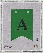 A taped needlepoint canvas with the design: Banner 18 mesh count Forked A Black on Green.