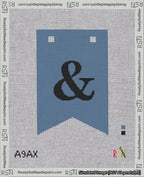 A taped needlepoint canvas with the design: Banner 18 mesh count Forked Ampersand Black on Blue.
