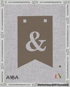 A taped needlepoint canvas with the design: Banner 18 mesh count Forked Ampersand White on Brown.