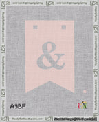 A taped needlepoint canvas with the design: Banner 18 mesh count Forked Ampersand White on Pink.