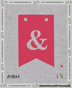 A taped needlepoint canvas with the design: Banner 18 mesh count Forked Ampersand White on Red.