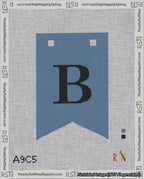 A taped needlepoint canvas with the design: Banner 18 mesh count Forked B Black on Blue.