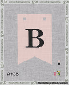 A taped needlepoint canvas with the design: Banner 18 mesh count Forked B Black on Pink.