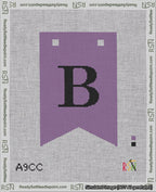 A taped needlepoint canvas with the design: Banner 18 mesh count Forked B Black on Purple.